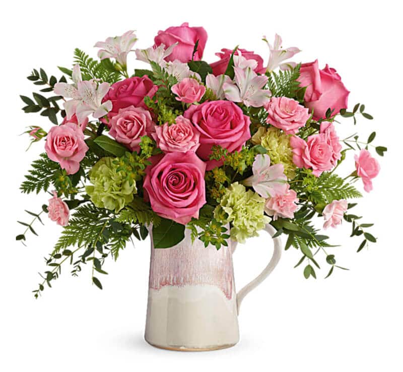 lush arrangement of roses, carnations, eucalyptus