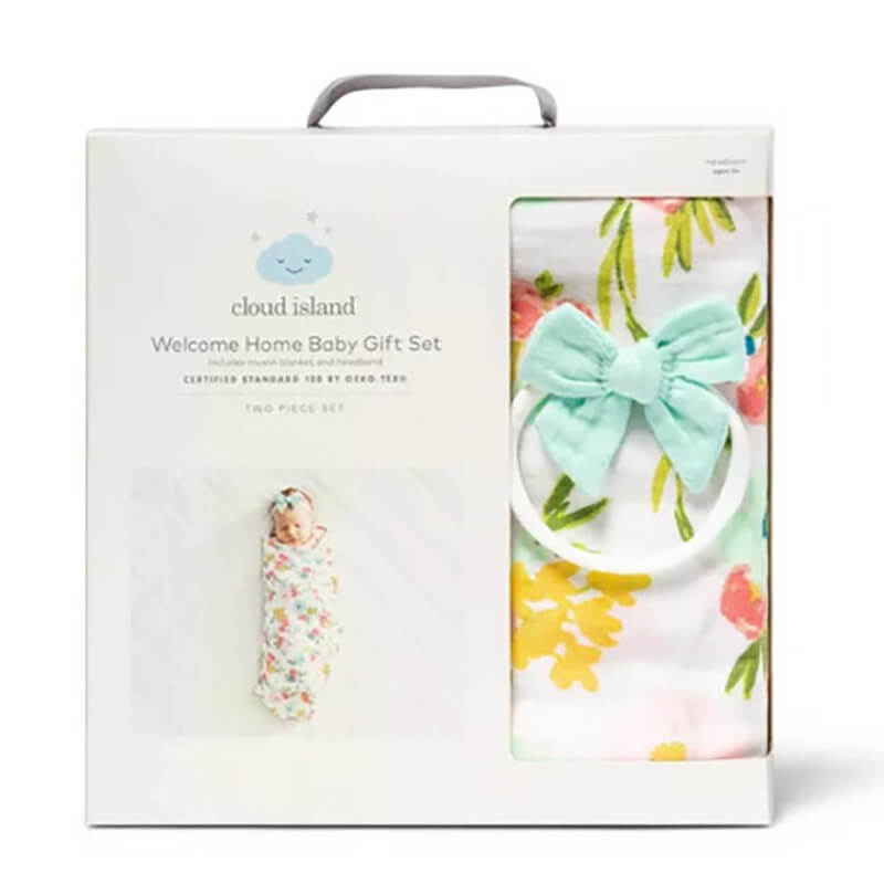 Two piece set that includes a beautiful soft muslin blanket with floral designs