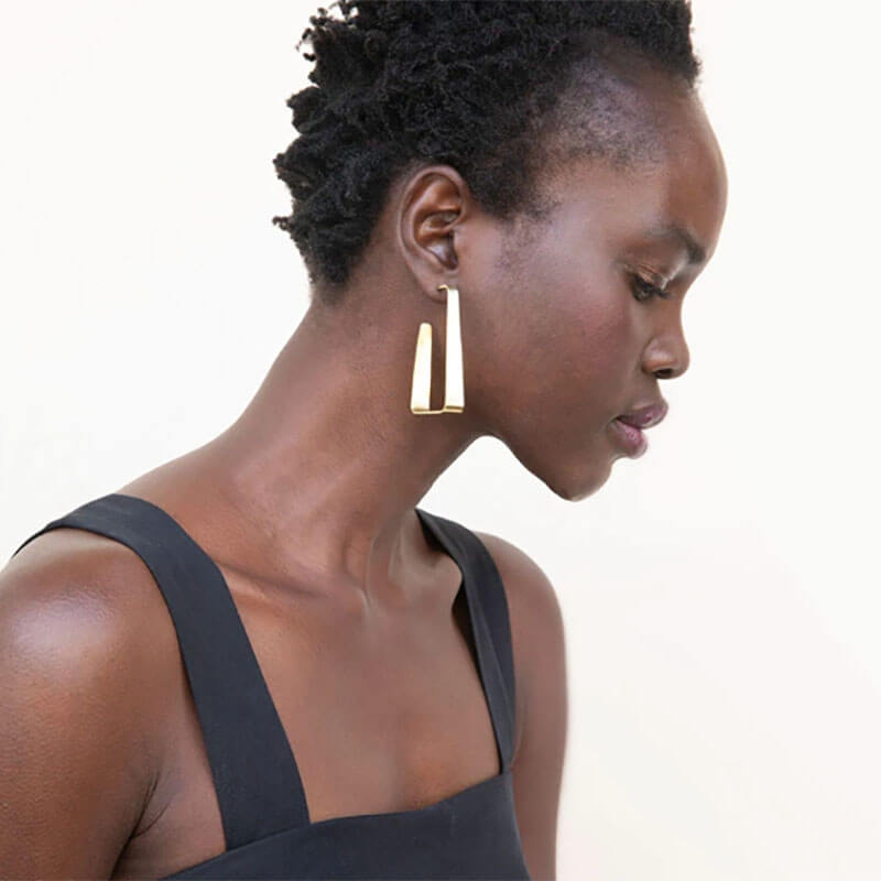 Girl wearing earring from SOKO jewelry