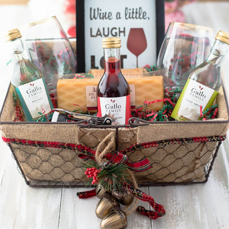 Basket of drinking wine with glass and candle